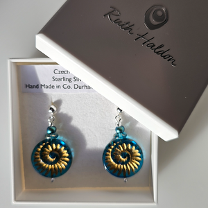 Teal/golden, glass ammonite post earrings Teal/golden, glass ammonite post earrings