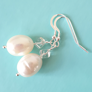 White, large, freshwater pearls and rock crystal short hook earrings. White, large, freshwater pearls and rock crystal short hook earrings.