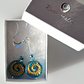 Teal/golden, glass ammonite hook earrings
