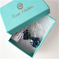 Teal spotted heart hook earrings