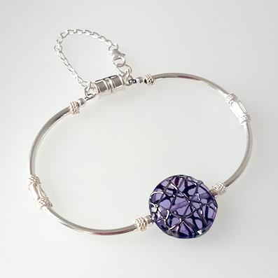 Purple disc lamp-work bead and silver bracelet