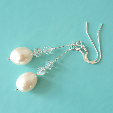 Freshwater pearl drop with rock crystals, long hook earrings.