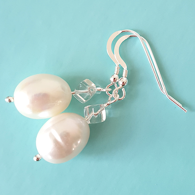 White, large, freshwater pearls and rock crystal short hook earrings.